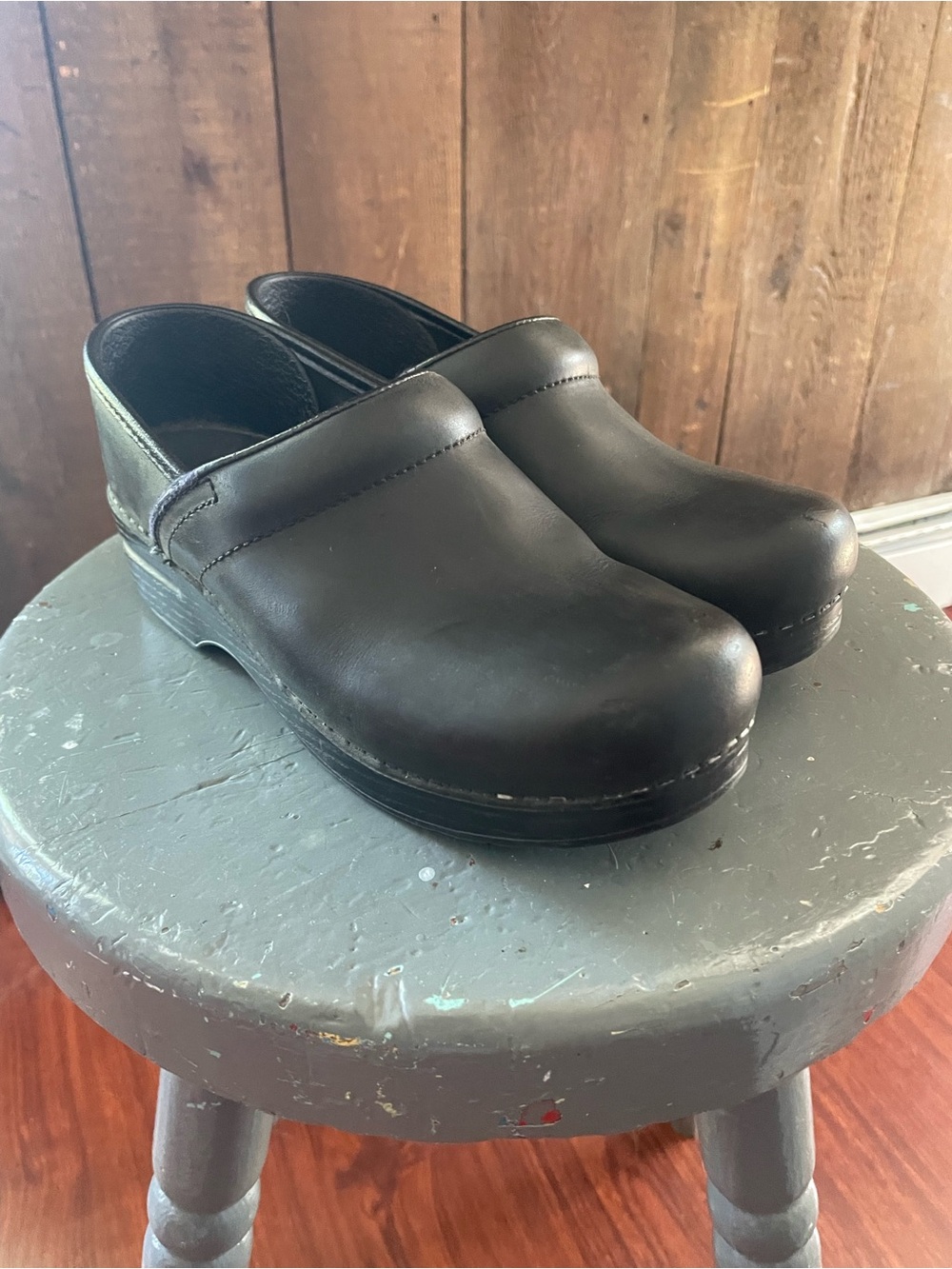 Dansko black leather clogs